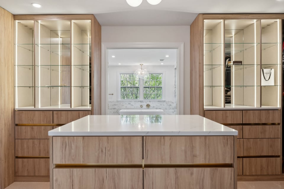 Custom closet renovation with illuminated glass shelving by DesignLab in Metro Washington