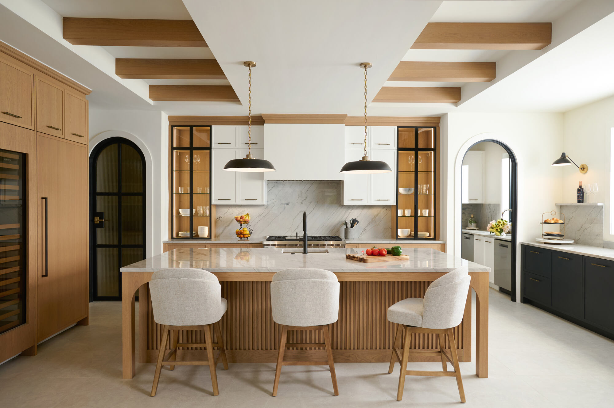 Luxury kitchen remodel by DesignLab in Chevy Chase, DC showcasing modern pendant lighting and wood-accented ceiling beams