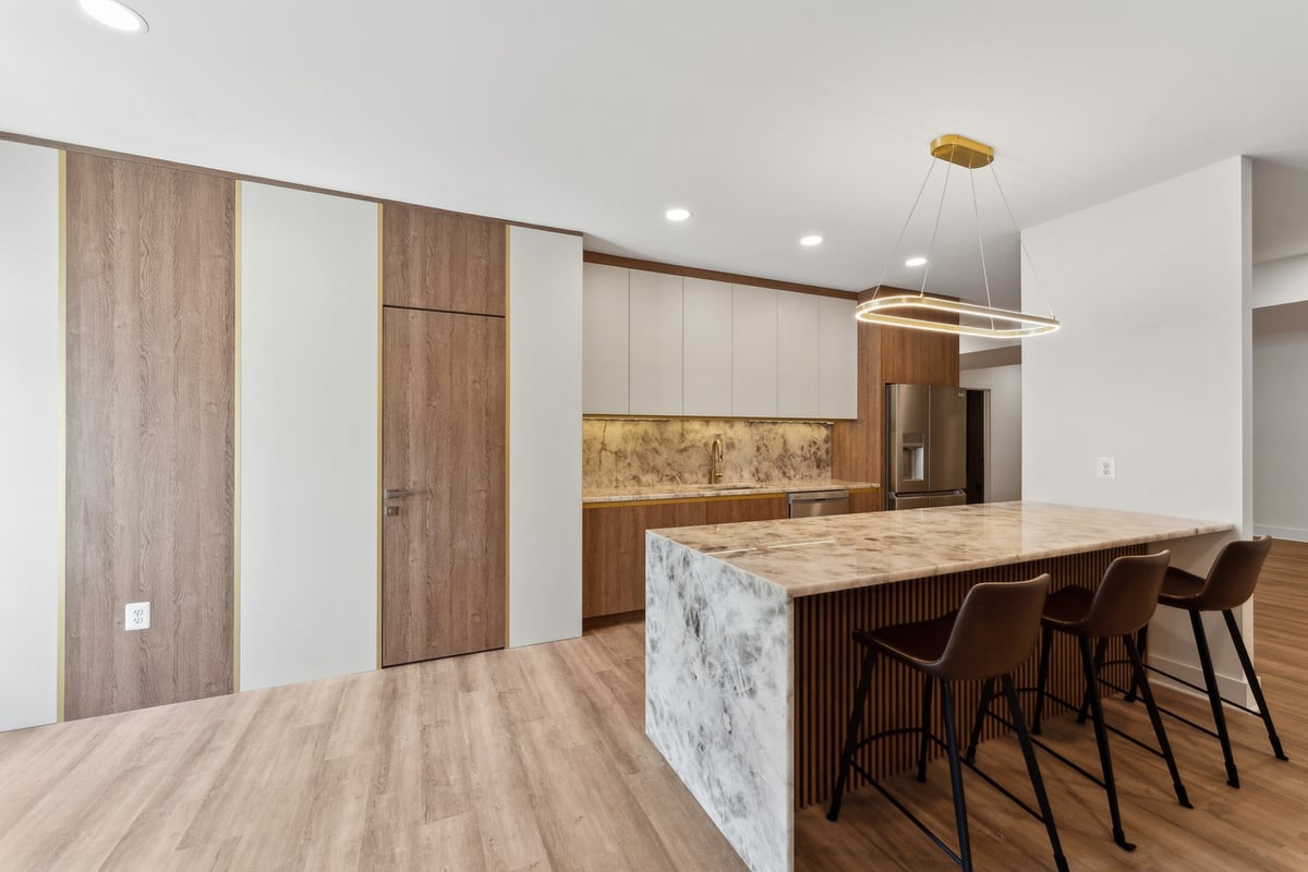 Metro DC kitchen with waterfall island and light wood floors