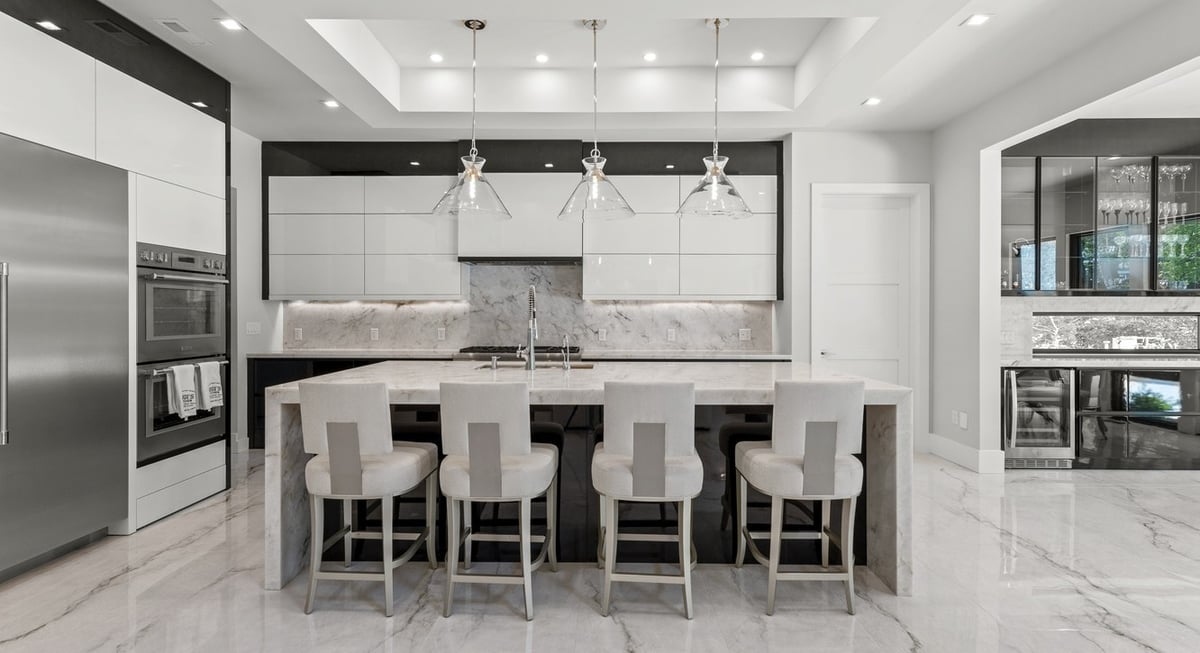 Luxury kitchen with marble island and pendant lights by DesignLab in Northern Virginia remodel