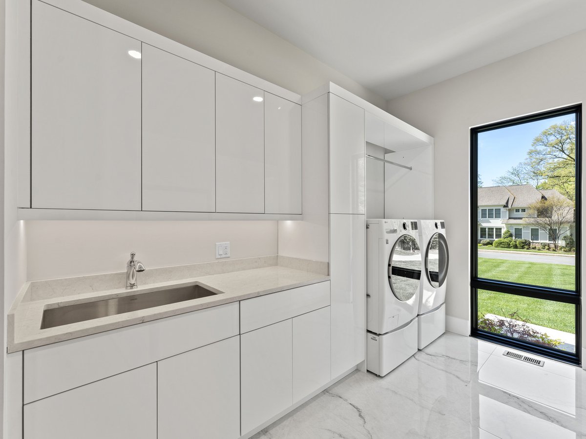 Sleek laundry room with modern cabinetry by DesignLab in Northern Virginia whole home project