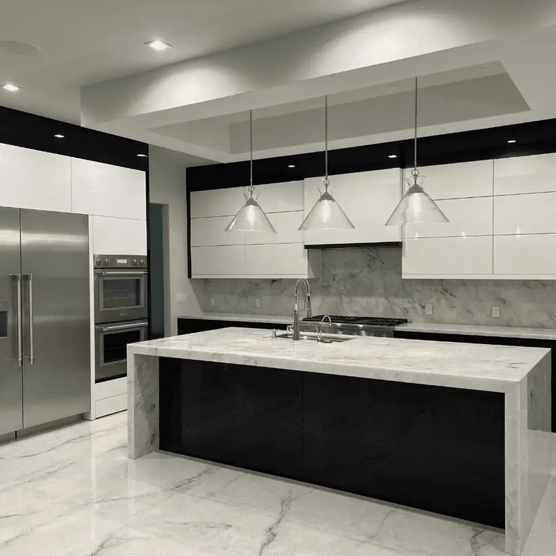 Custom kitchen with marble island countertops and sleek, white cabinets in Northern Virginia.