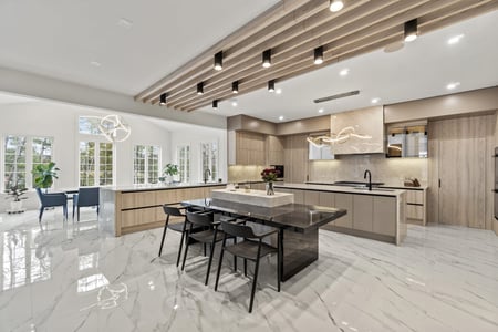 Expansive modern kitchen with dual islands and wood ceiling detail by designlab in Northern Virginia