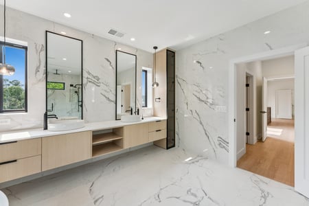 Bright modern bathroom remodel by DesignLab featuring marble walls in AU Park, DC