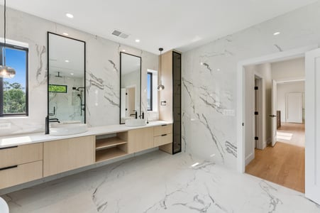 Bright modern bathroom remodel by DesignLab featuring marble walls in AU Park, DC