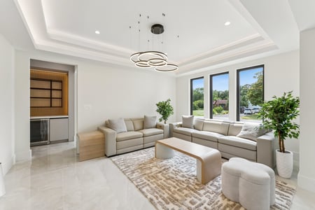 Bright modern living room with large windows and neutral decor by DesignLab in Washington, DC