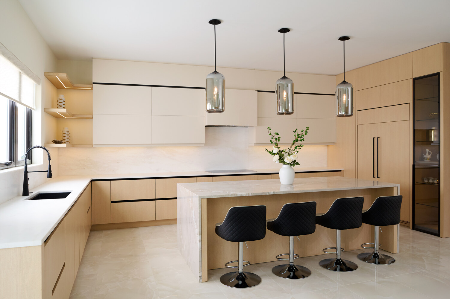 Contemporary kitchen design with quartz countertops and pendant lights by DesignLab in Metro Washington