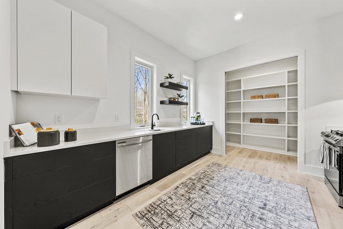 Sleek butler’s pantry with floating shelves and built-in shelving by DesignLab in Potomac, MD
