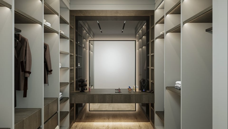 Luxury walk-in closet with soft lighting and central vanity designed by DesignLab in McLean, VA