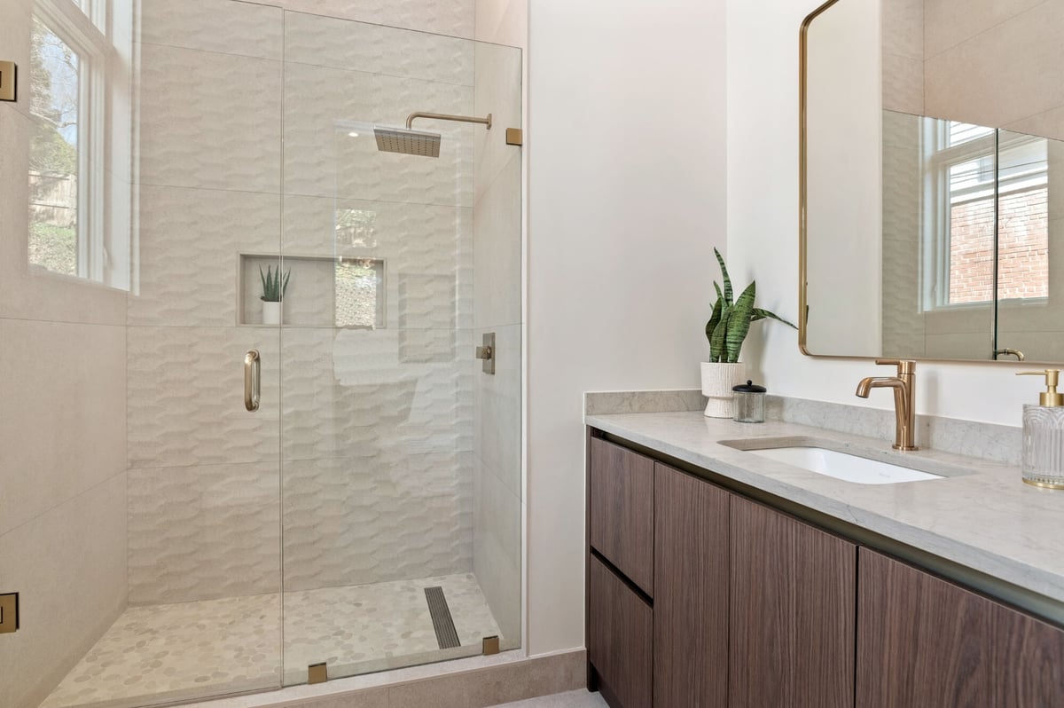 bathroom remodel with walk in shower and flat panel cabinetry vanity