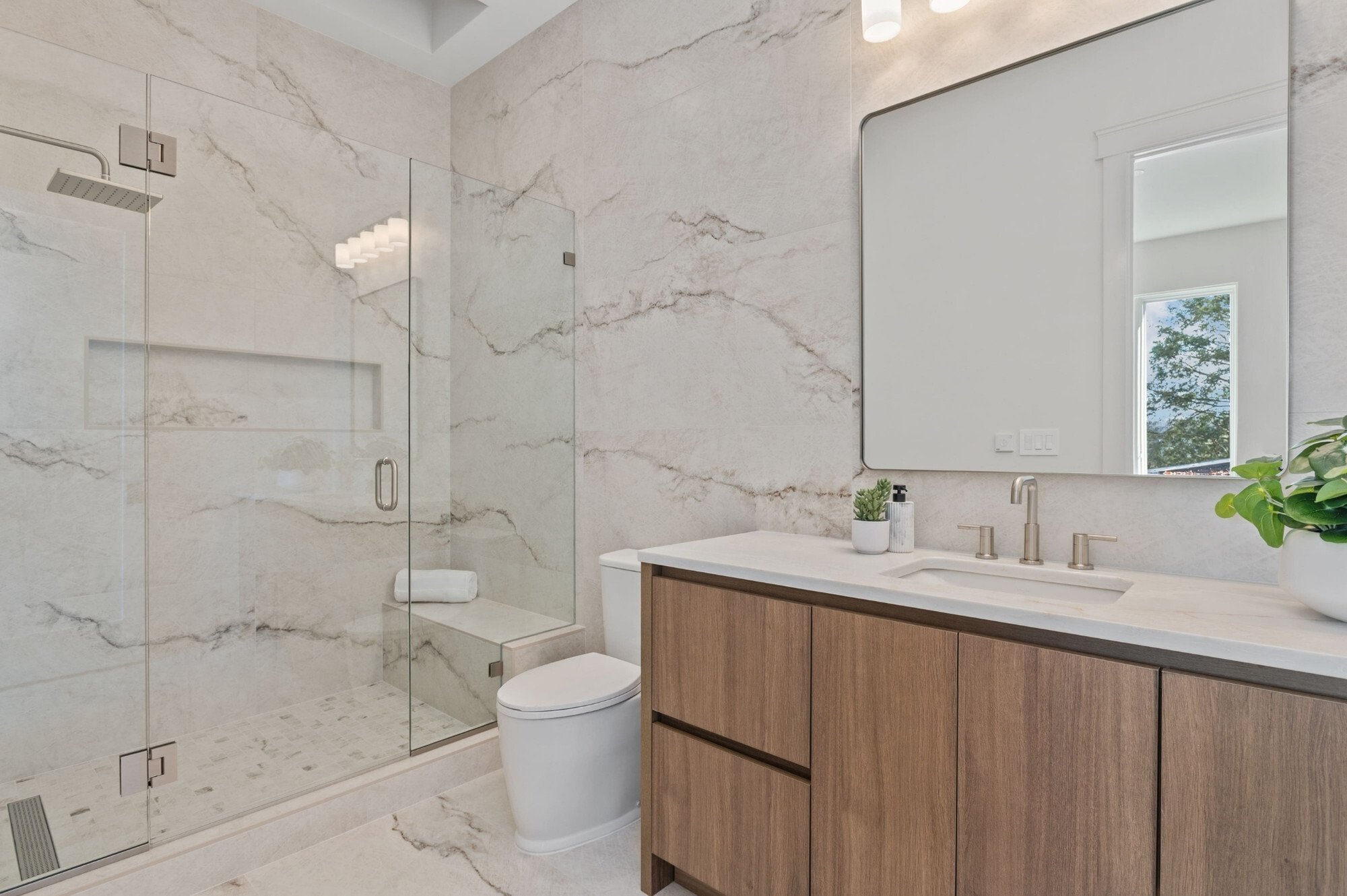large bathroom remodel with floor to ceiling stonework in dc