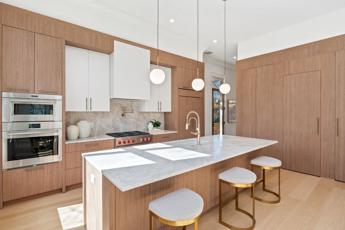 large kitchen redesign with bar stool seating in dc home renovation