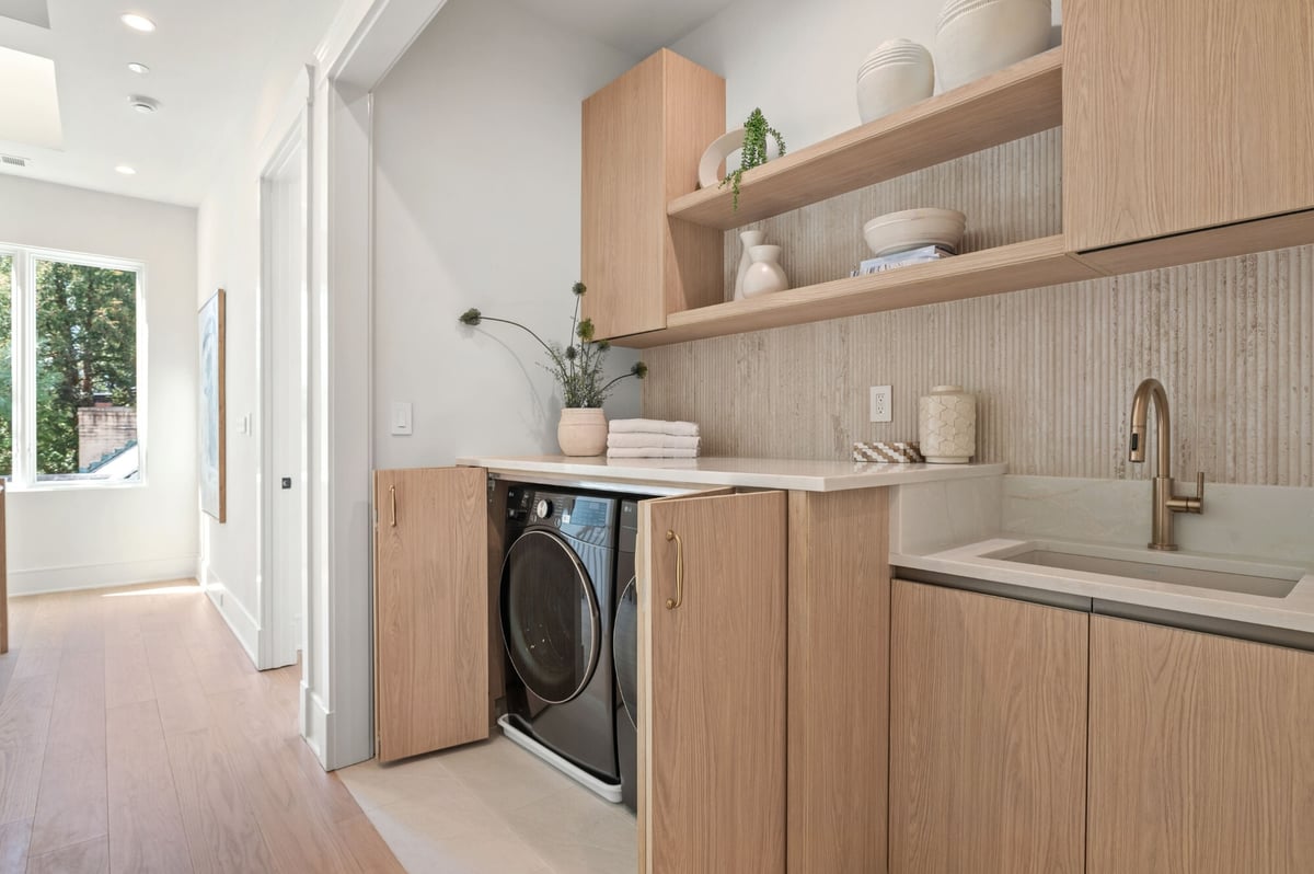 laundry room design with flat panel cabinets
