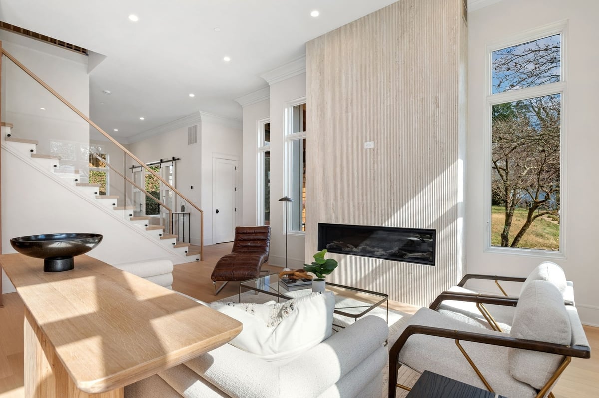 luxury living room remodel in dc with fluted wood fireplace