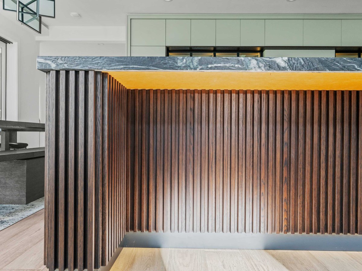 Design details in a luxury kitchen in Mclean, VA with fluted kitchen island and flat panel cabinets