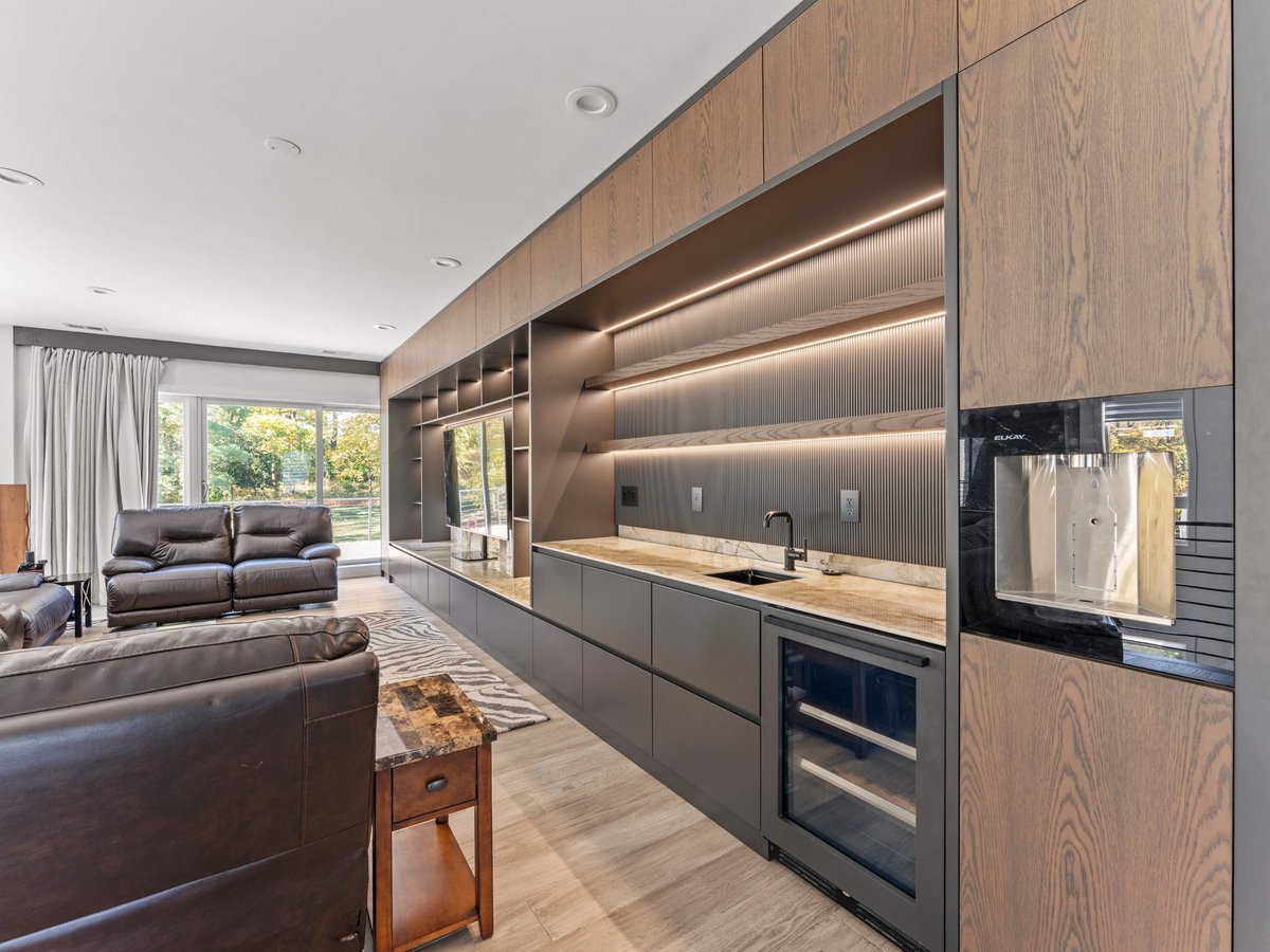 Entertainment room with wet bar and water refill station