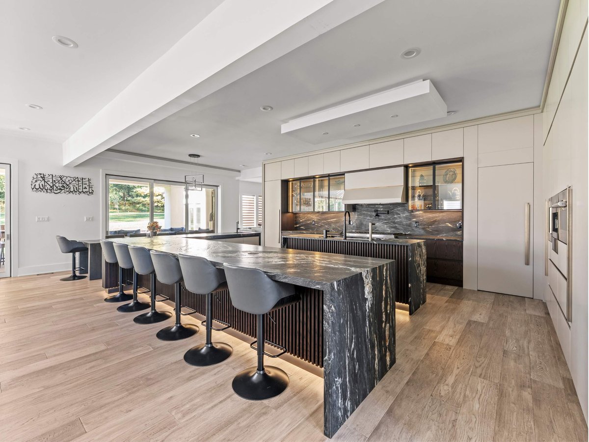 Luxury kitchen remodel in Mclean, VA with waterfall edge kitchen island