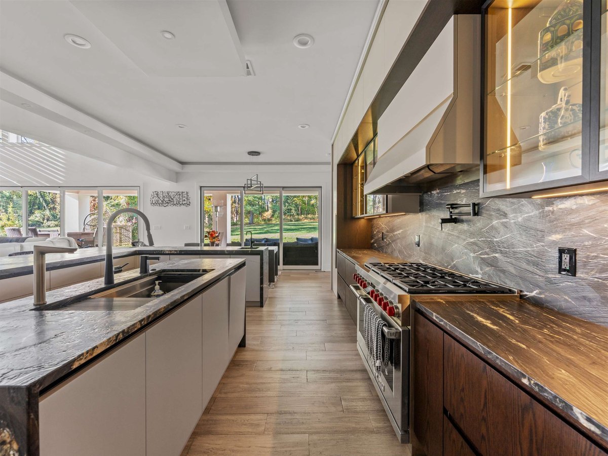 Luxury kitchen renovation in mclean, va with stainless steel oven and vent hood