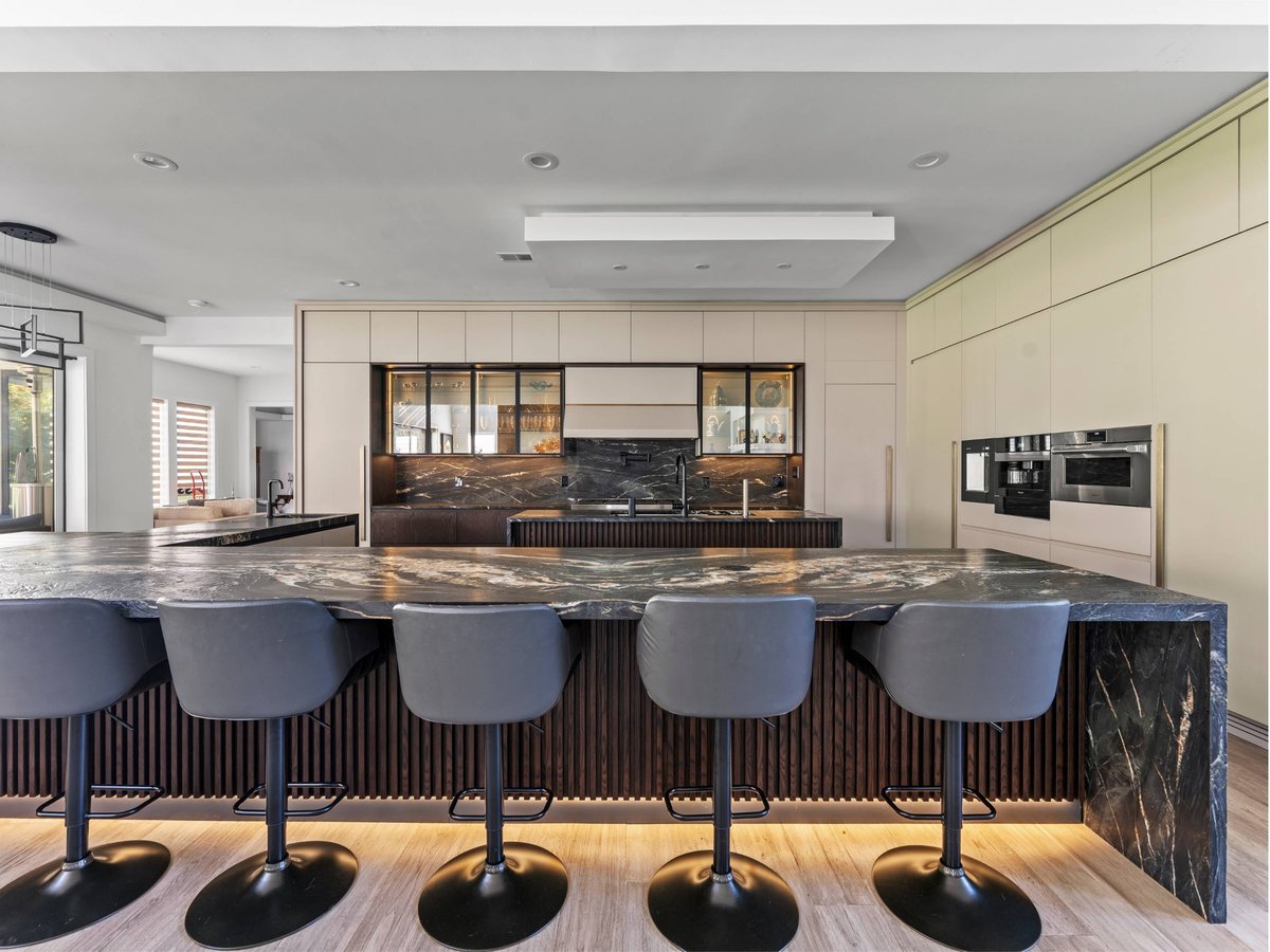 dark marble kitchen island with waterfall edge in a mclean, va kitchen remodel