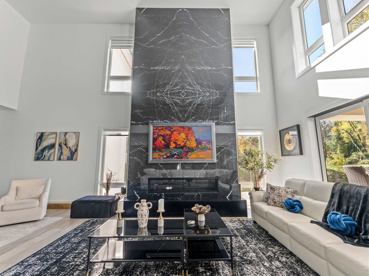 luxury living room remodel with statement fireplace in mclean, va