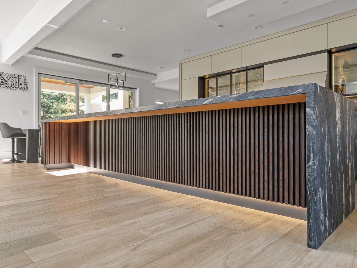 under kitchen island with wood fluting details in kitchen remodel in mclean, va