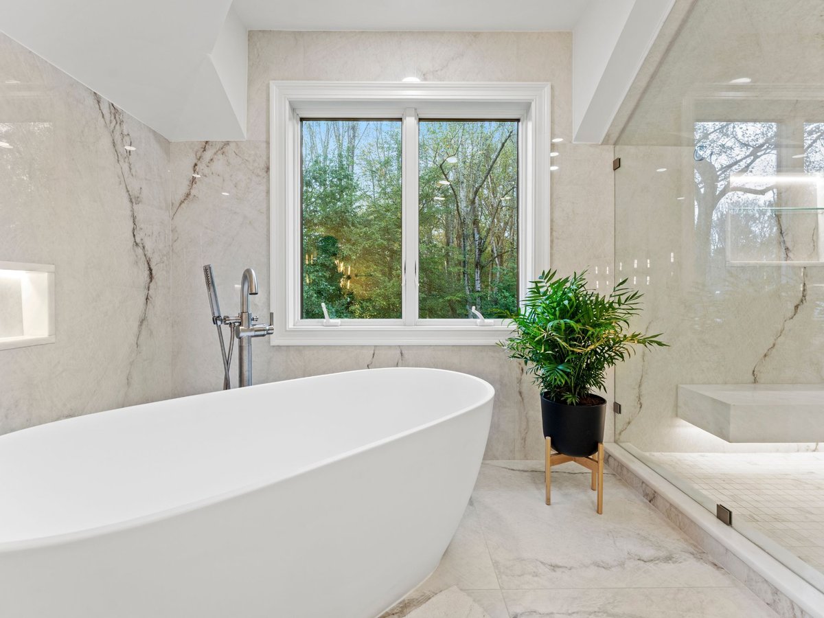 Luxury bathroom remodel in washington dc with large white tub