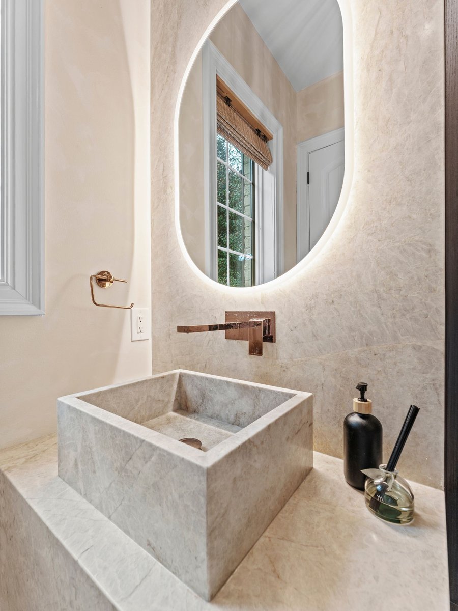 Luxury bathroom remodel in washington dc with stone sink and mirror (1)