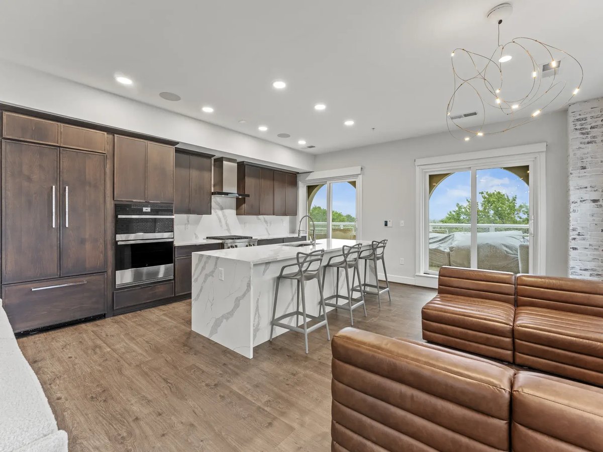 slater-condo-remodel-kitchen-waterfall-quartz-island-dark-cabinetry