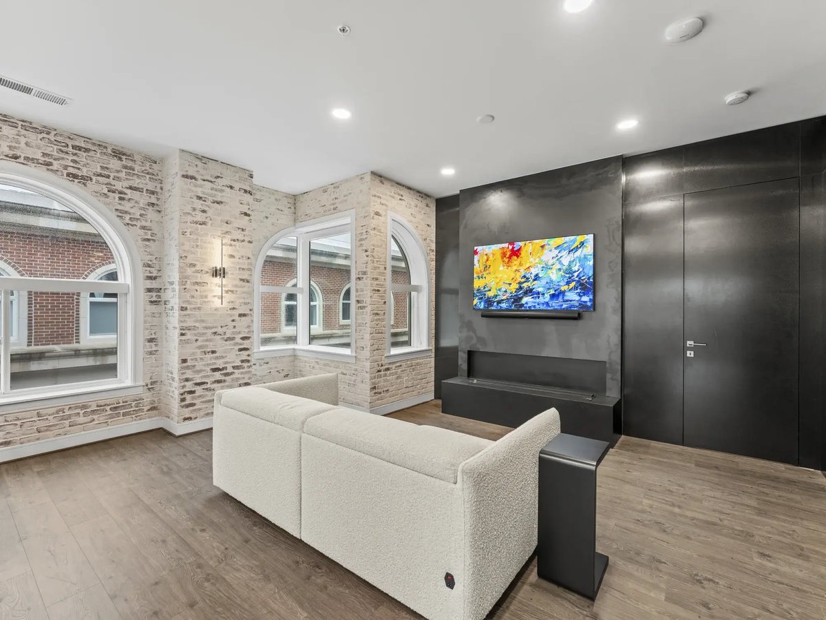 slater-condo-remodel-living-room-boucle-sofa-exposed-brick