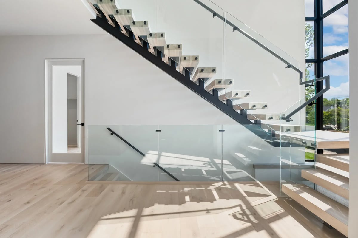 506-stephen-circle-floating-staircase-glass-railing-entry