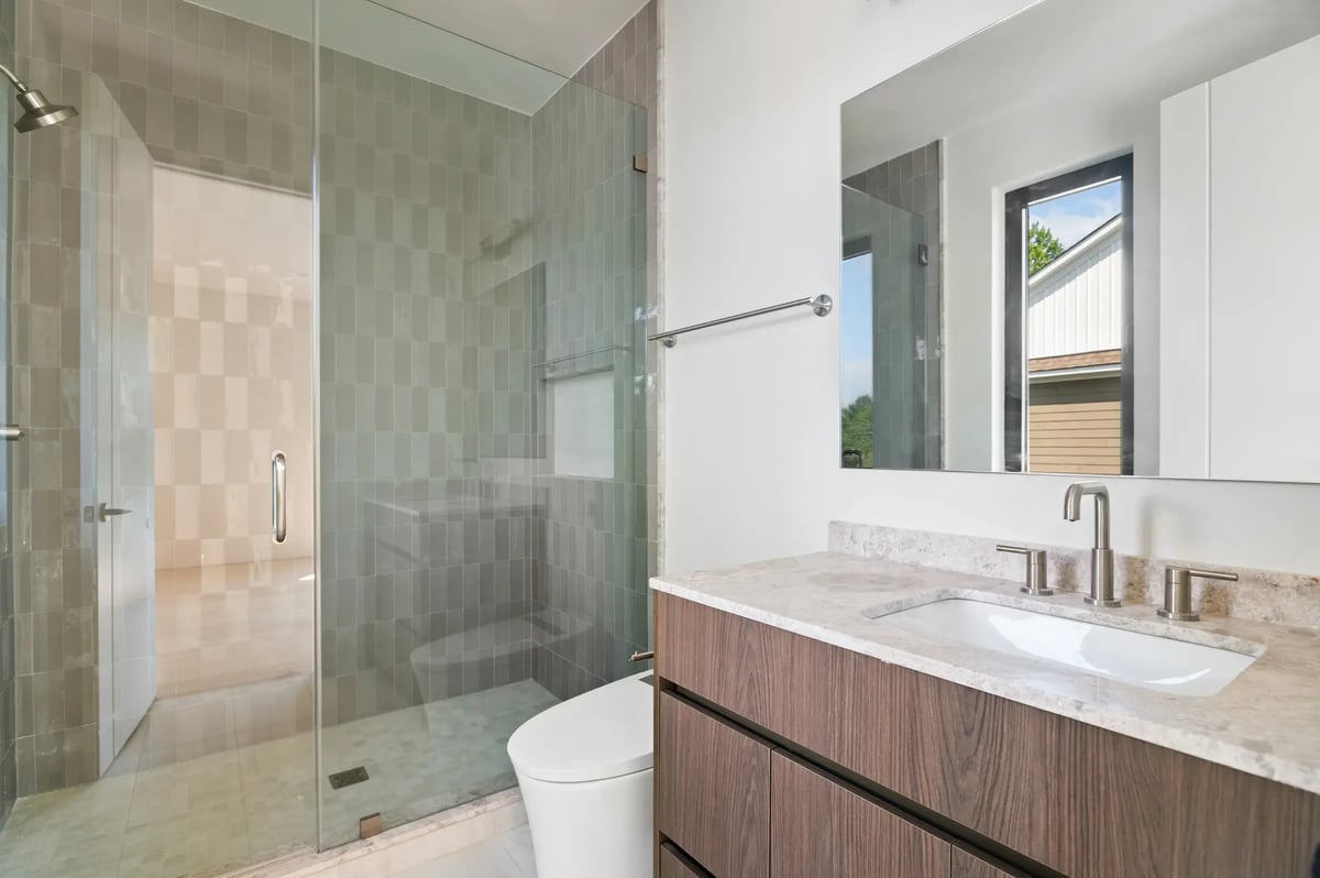 506-stephen-circle-guest-bathroom-tiled-shower-wood-vanity