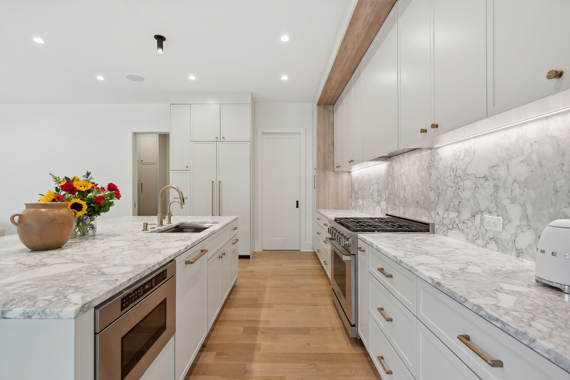 Elegant white kitchen with marble countertops by DesignLab as part of a Washington, DC whole home project