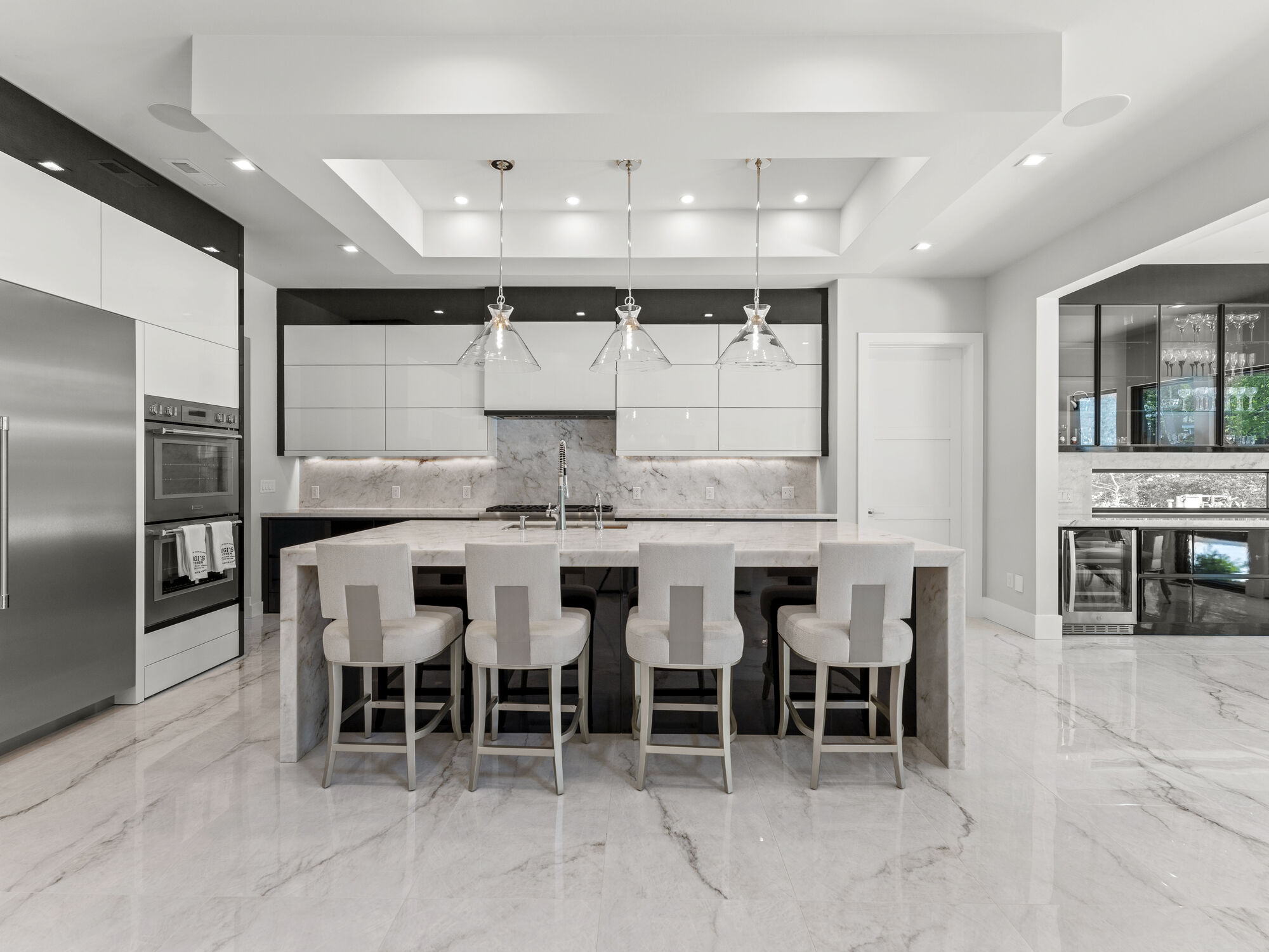 Luxury kitchen with marble island and pendant lights by DesignLab in Northern Virginia remodel