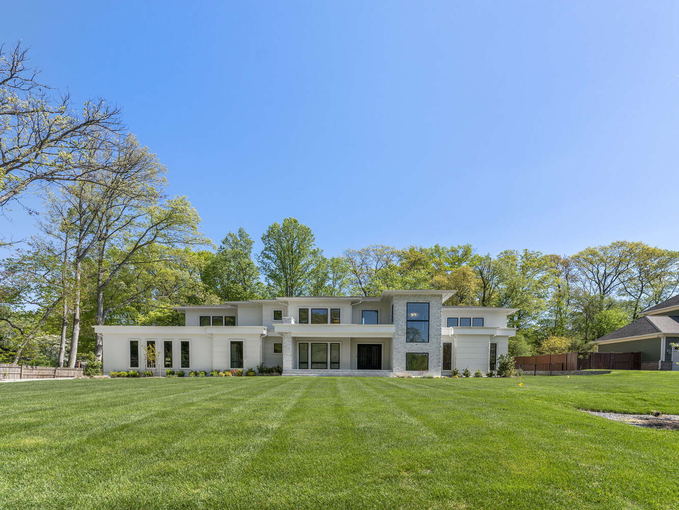 Front elevation showcasing sleek design and lawn space in a DesignLab home in Bethesda, MD