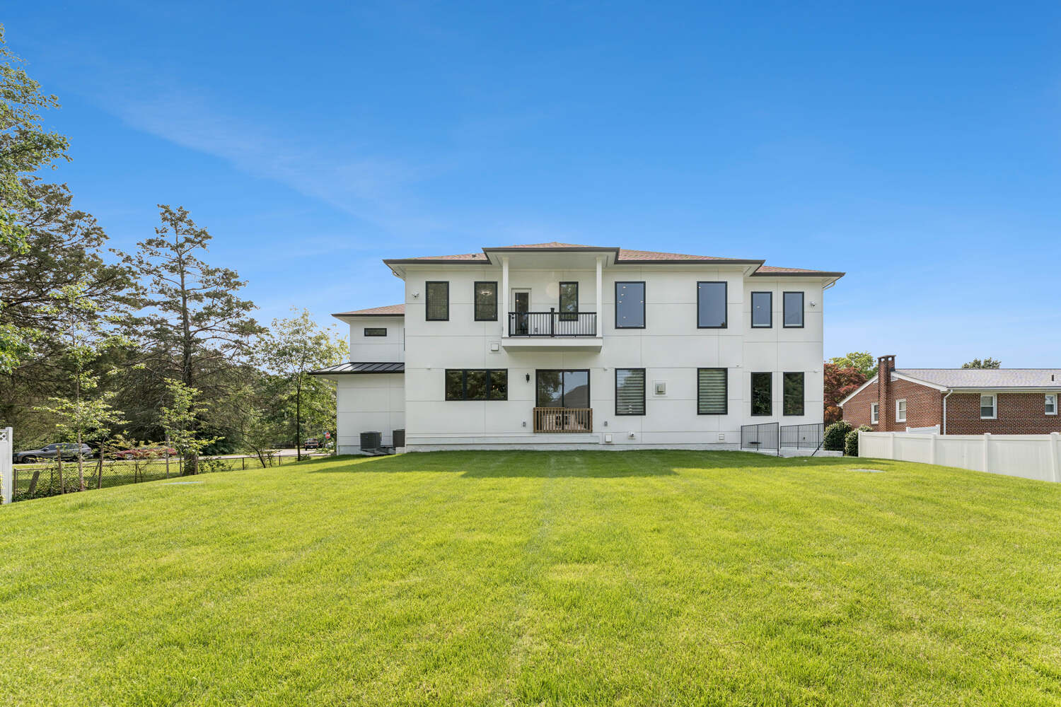 Backyard perspective of elegant custom home by DesignLab serving Arlington, Falls Church, and Vienna, VA