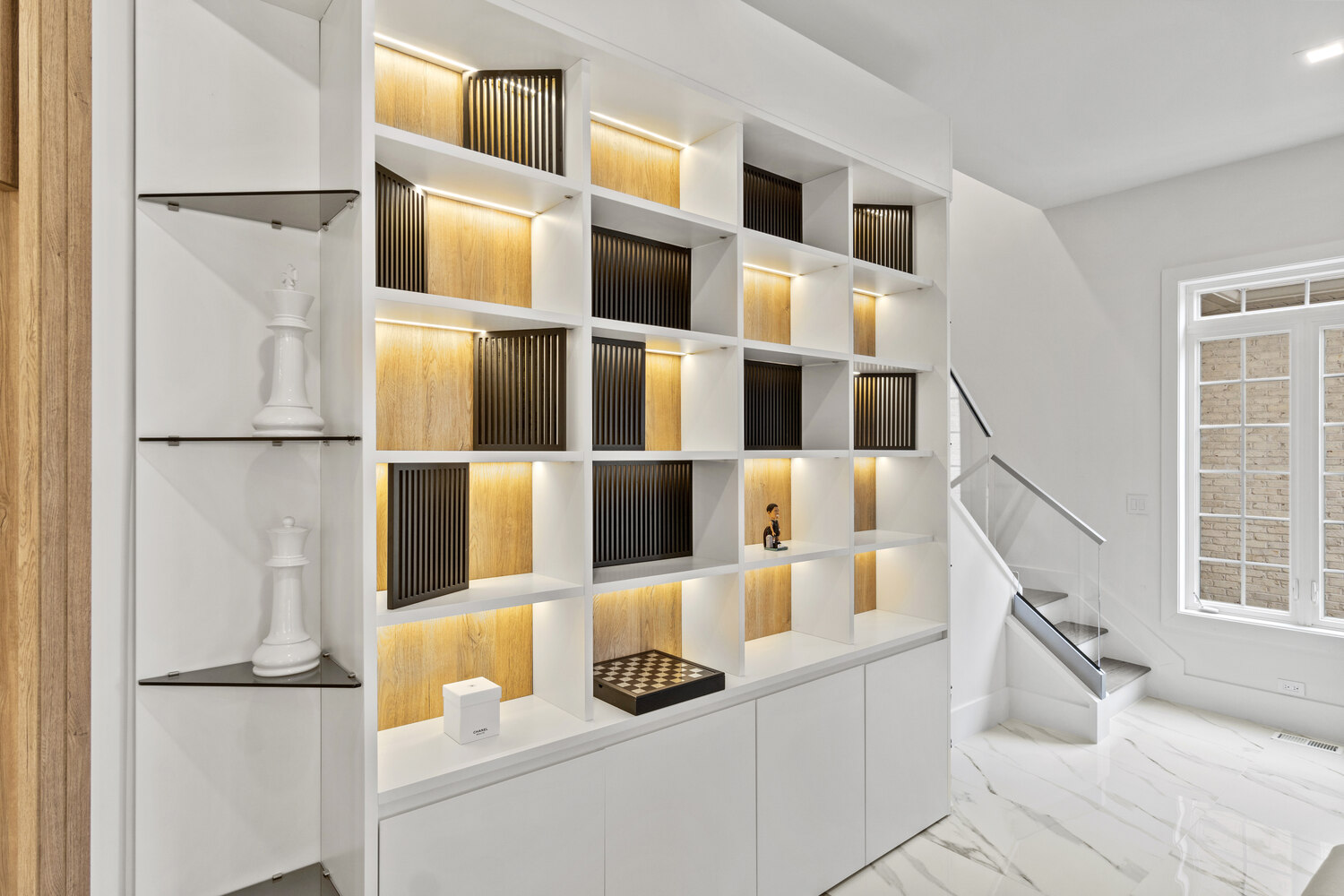 Built-in shelving with accent lighting in Washington, DC home office by DesignLab