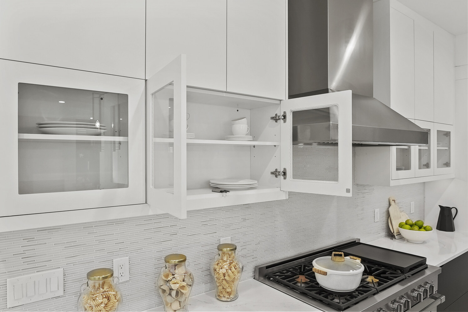 White upper cabinets with display shelving in a modern Metro Washington kitchen by DesignLab