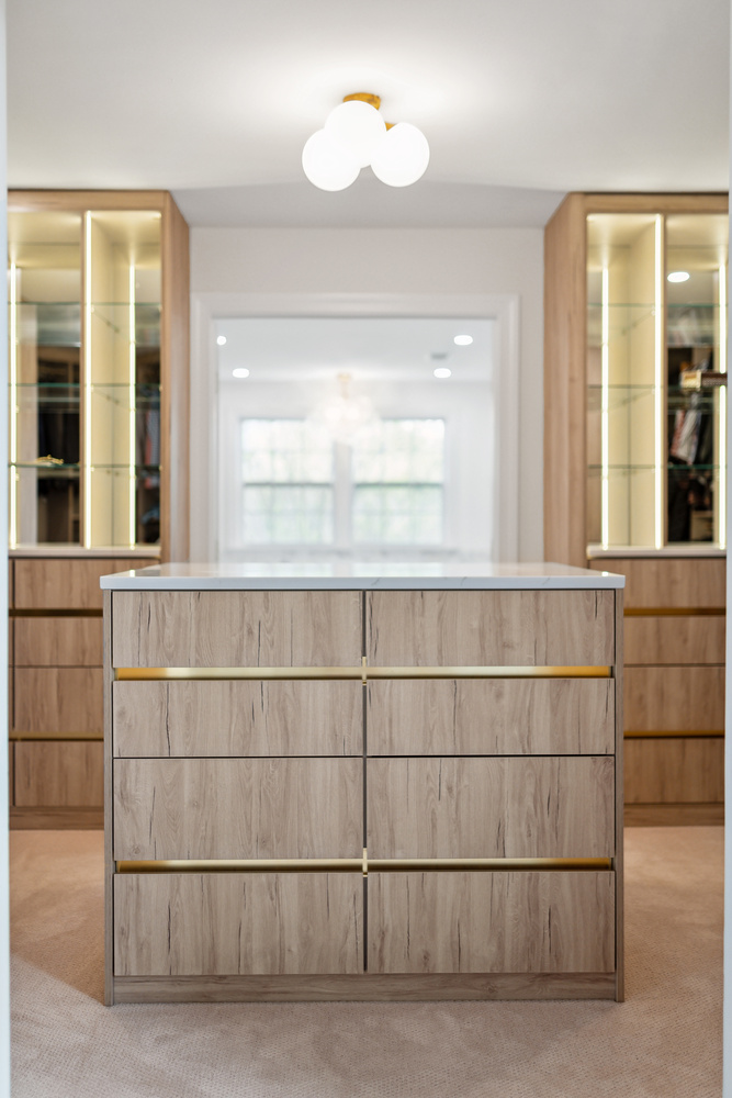 Central island dresser in a luxury custom closet by DesignLab in Washington, DC