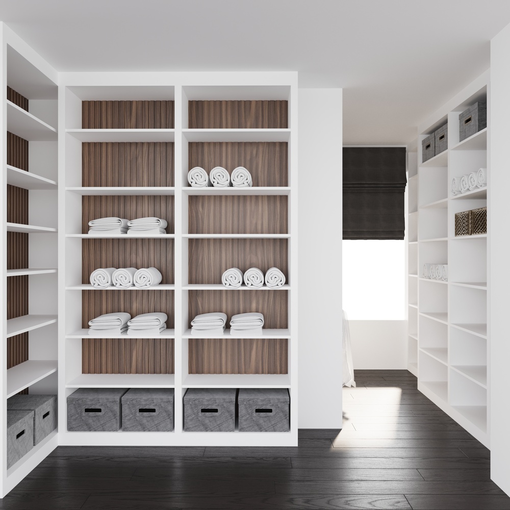 Elegant white storage shelves with organized linens in a custom home by DesignLab in Falls Church, VA