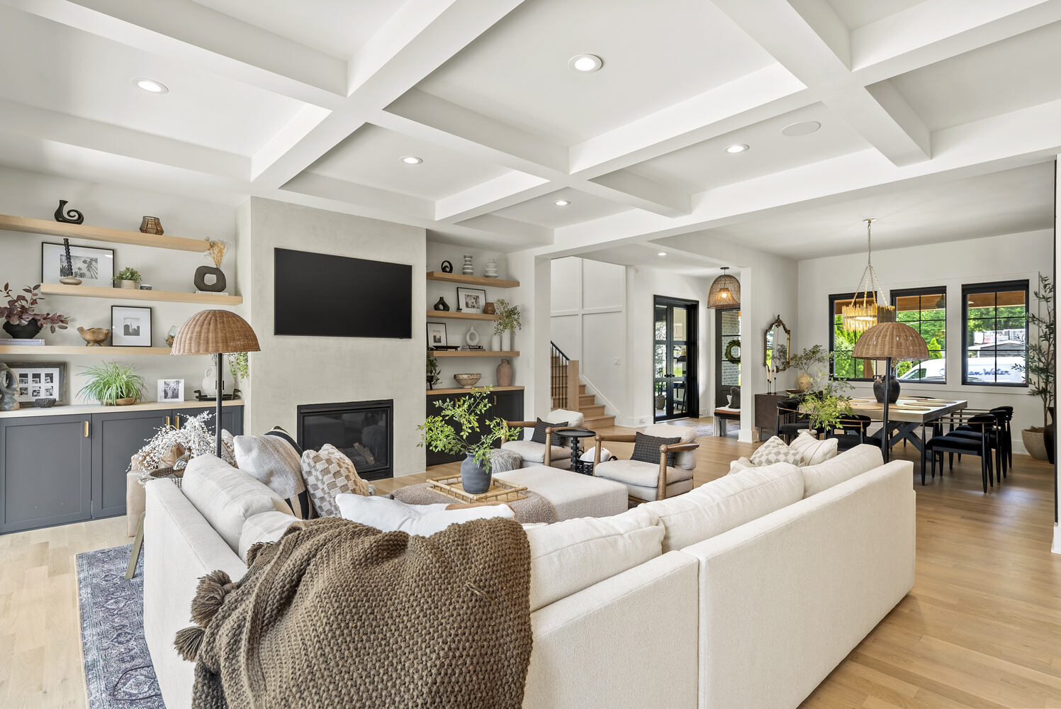 Family room with coffered ceilings and built-in shelves by DesignLab in a custom home in Metro Washington