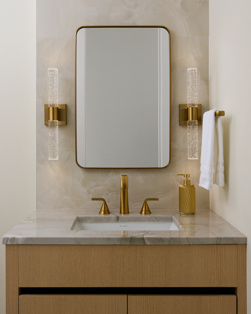 Luxurious marble-topped vanity with gold hardware by DesignLab in a Washington, DC custom home