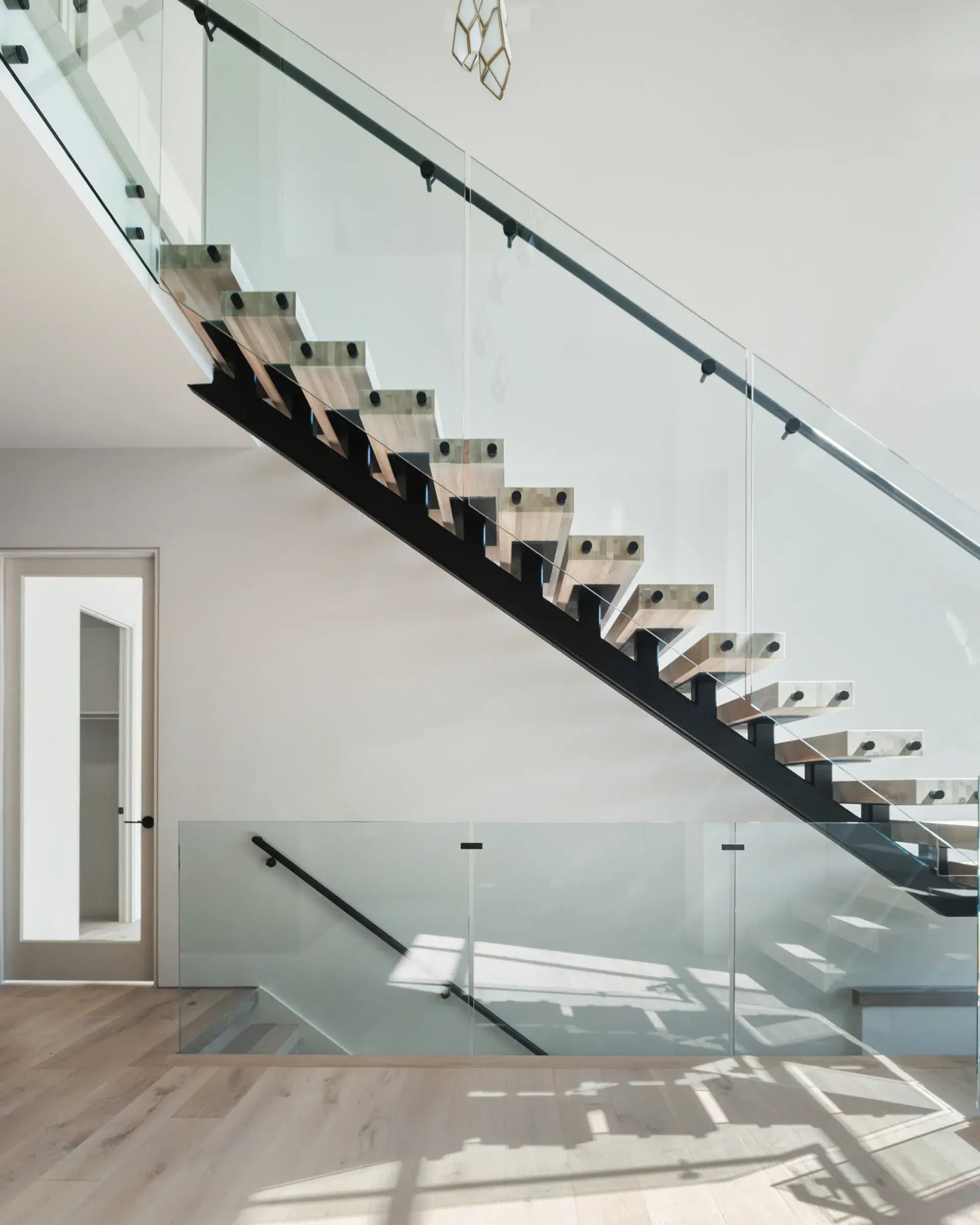 506-stephen-circle-floating-staircase-steel-stringer-glass-railing